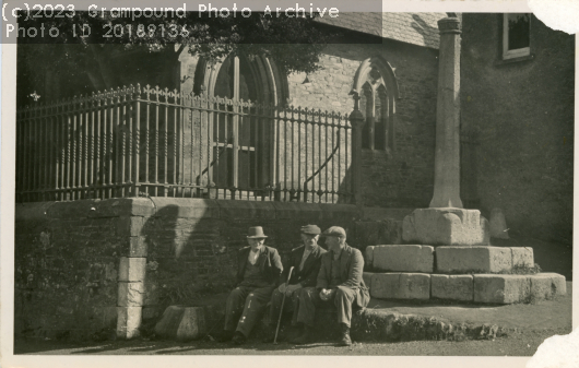 Picture of Three men sitting by the market cross
